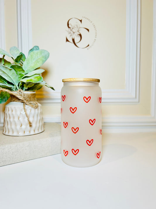 Frosted glass cup with red heart patterns 